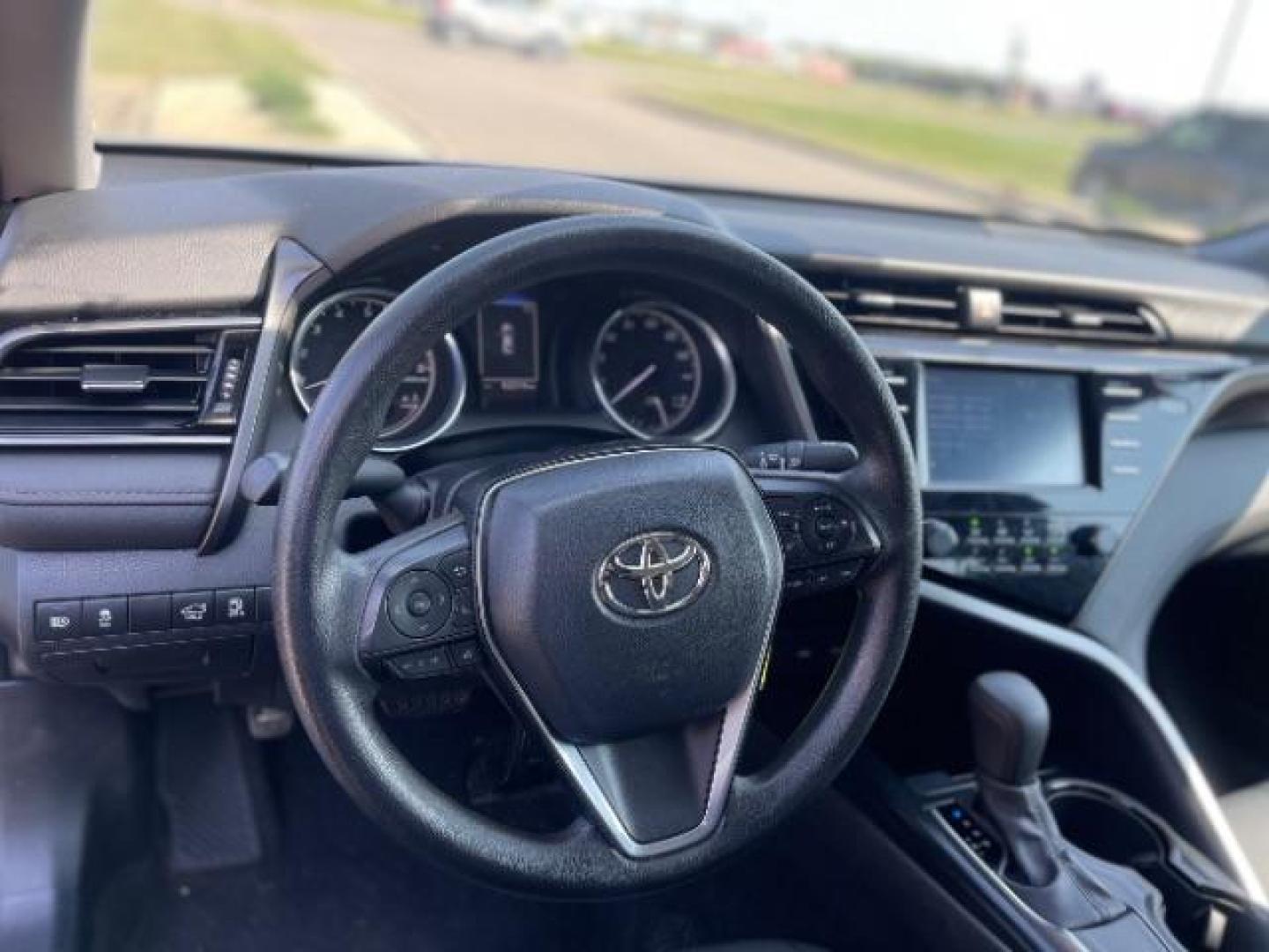 2020 Midnight Black Metallic Toyota Camry LE (4T1C11AK8LU) with an 2.5L L4 DOHC 16V engine, 8-Speed Automatic transmission, located at 745 S Robert St, St. Paul, MN, 55107, (651) 222-2991, 44.923389, -93.081215 - Photo#1