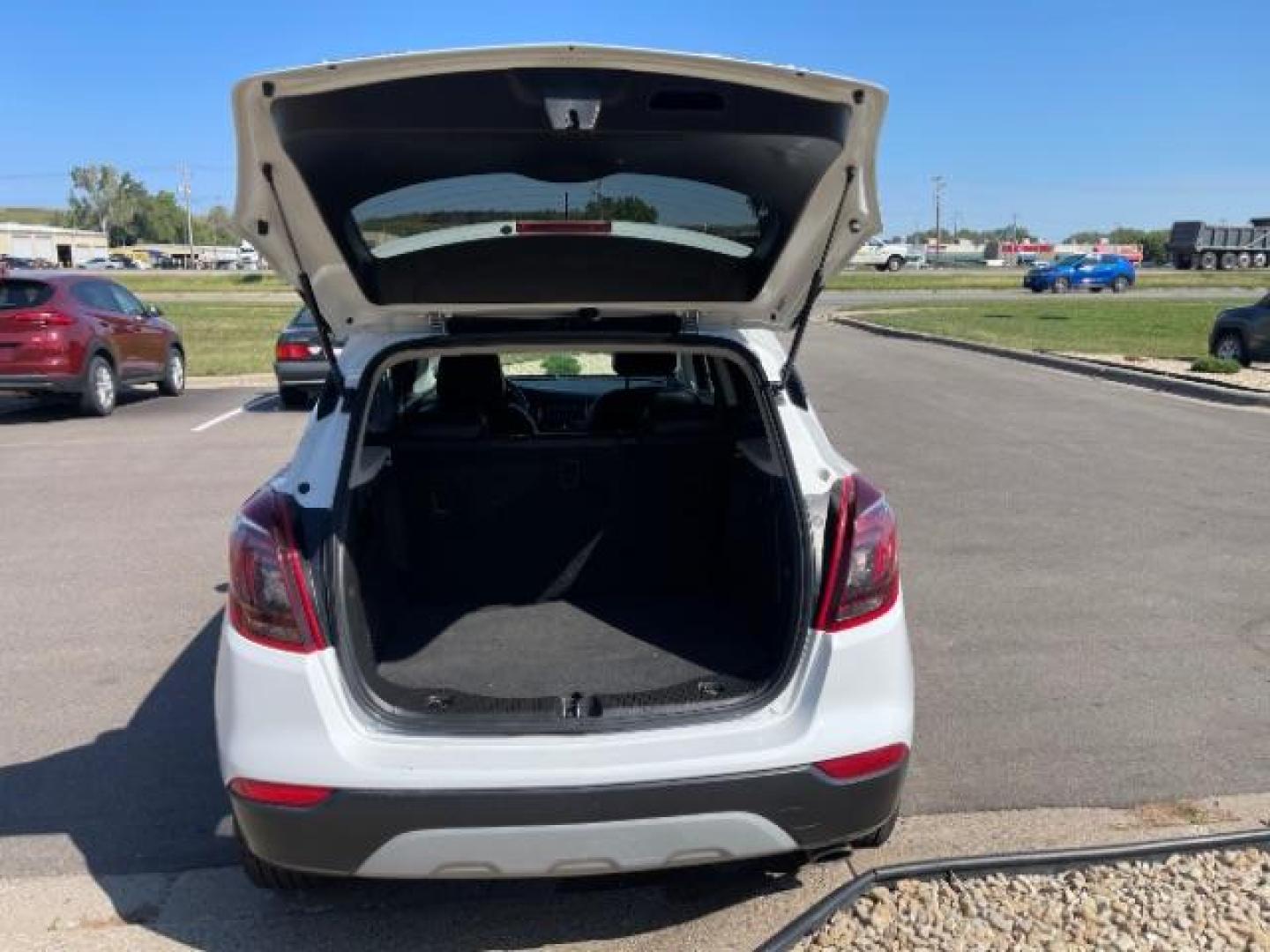 2018 Summit White/Black Carbon Metallic Buick Encore Preferred II FWD (KL4CJBSBXJB) with an 1.4L L4 DOHC 16V TURBO engine, 6-Speed Automatic transmission, located at 745 S Robert St, St. Paul, MN, 55107, (651) 222-2991, 44.923389, -93.081215 - Photo#2