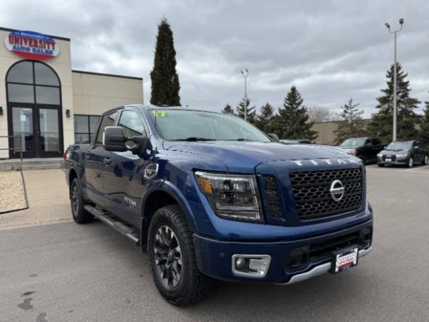 2017 Deep Blue Pearl Nissan Titan PRO-4X Crew Cab 4WD (1N6AA1E58HN) with an 5.6L V8 DOHC 32V engine, 6-Speed Automatic transmission, located at 3301 W Hwy 13, Burnsville, MN, 55337, (952) 460-3200, 44.775333, -93.320808 - Photo#4