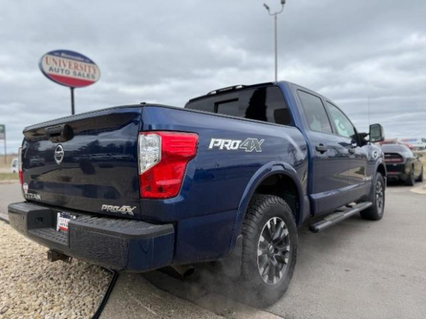 2017 Deep Blue Pearl Nissan Titan PRO-4X Crew Cab 4WD (1N6AA1E58HN) with an 5.6L V8 DOHC 32V engine, 6-Speed Automatic transmission, located at 3301 W Hwy 13, Burnsville, MN, 55337, (952) 460-3200, 44.775333, -93.320808 - Photo#7