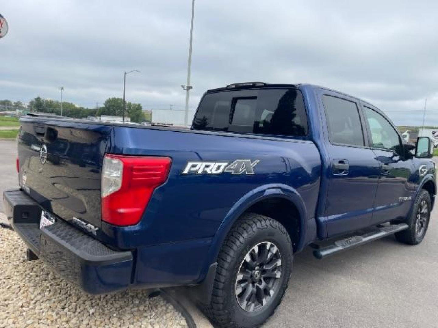 2017 Deep Blue Pearl Nissan Titan PRO-4X Crew Cab 4WD (1N6AA1E58HN) with an 5.6L V8 DOHC 32V engine, 6-Speed Automatic transmission, located at 745 S Robert St, St. Paul, MN, 55107, (651) 222-2991, 44.923389, -93.081215 - Photo#4