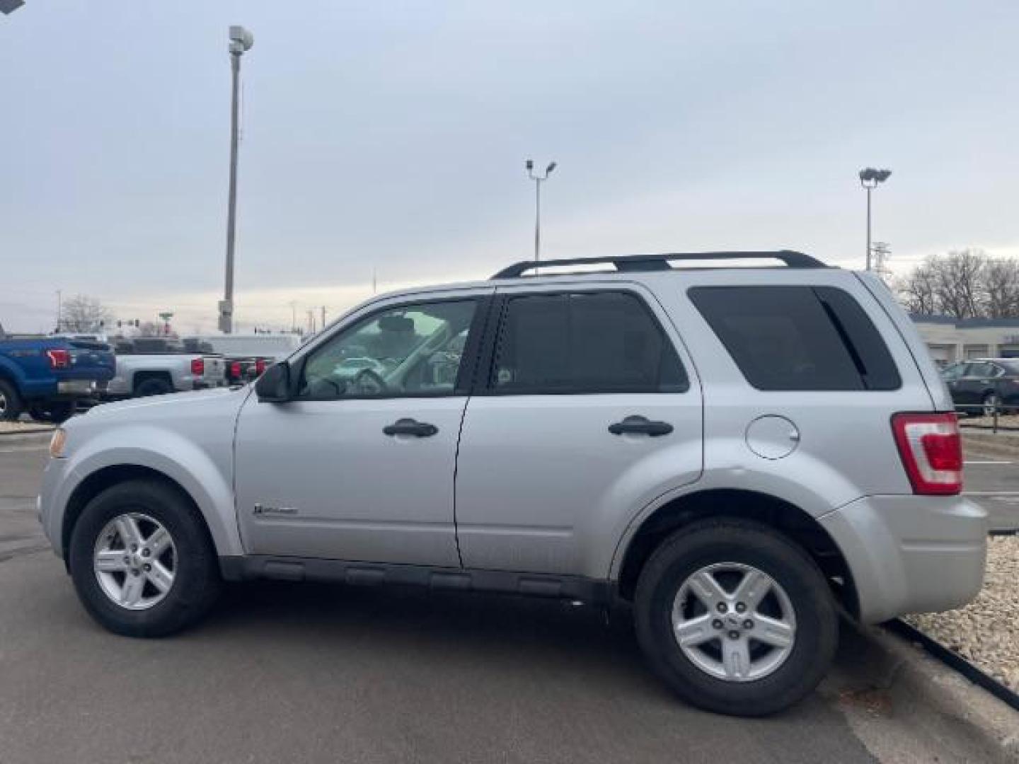 2009 Brilliant Silver Metallic Ford Escape Hybrid 4WD (1FMCU59319K) with an 2.3L L4 DOHC 16V HYBRID engine, Continuously Variable Transmission transmission, located at 3301 W Hwy 13, Burnsville, MN, 55337, (952) 460-3200, 44.775333, -93.320808 - Photo#7