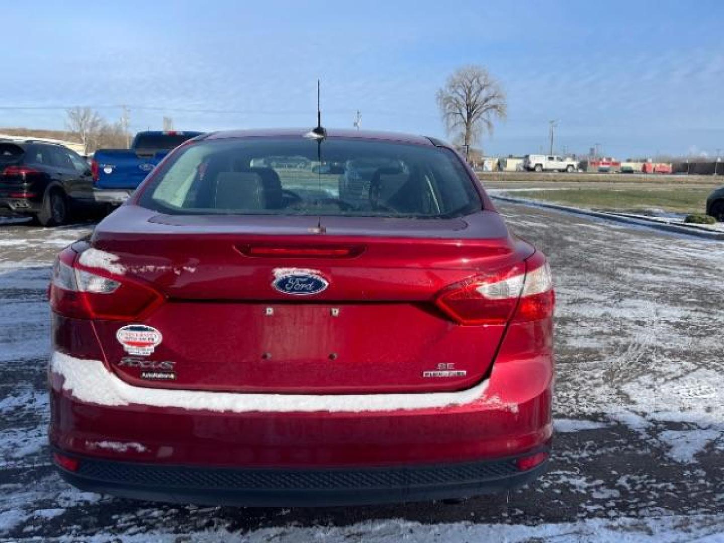 2014 Race Red Ford Focus SE Sedan (1FADP3F24EL) with an 2.0L L4 DOHC 16V engine, located at 3301 W Hwy 13, Burnsville, MN, 55337, (952) 460-3200, 44.775333, -93.320808 - Photo#2