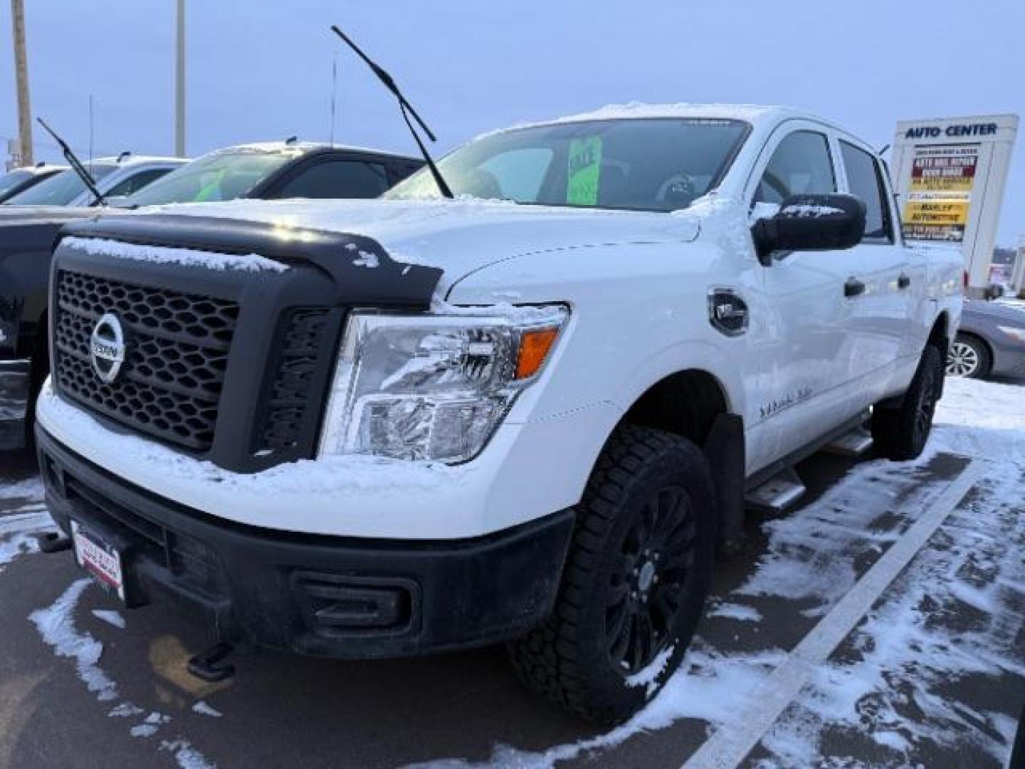 2016 Glacier White Nissan Titan XD S 4WD (1N6AA1F38GN) with an 5.6L V8 DOHC 32V engine, 6-Speed Automatic transmission, located at 3301 W Hwy 13, Burnsville, MN, 55337, (952) 460-3200, 44.775333, -93.320808 - Photo#1