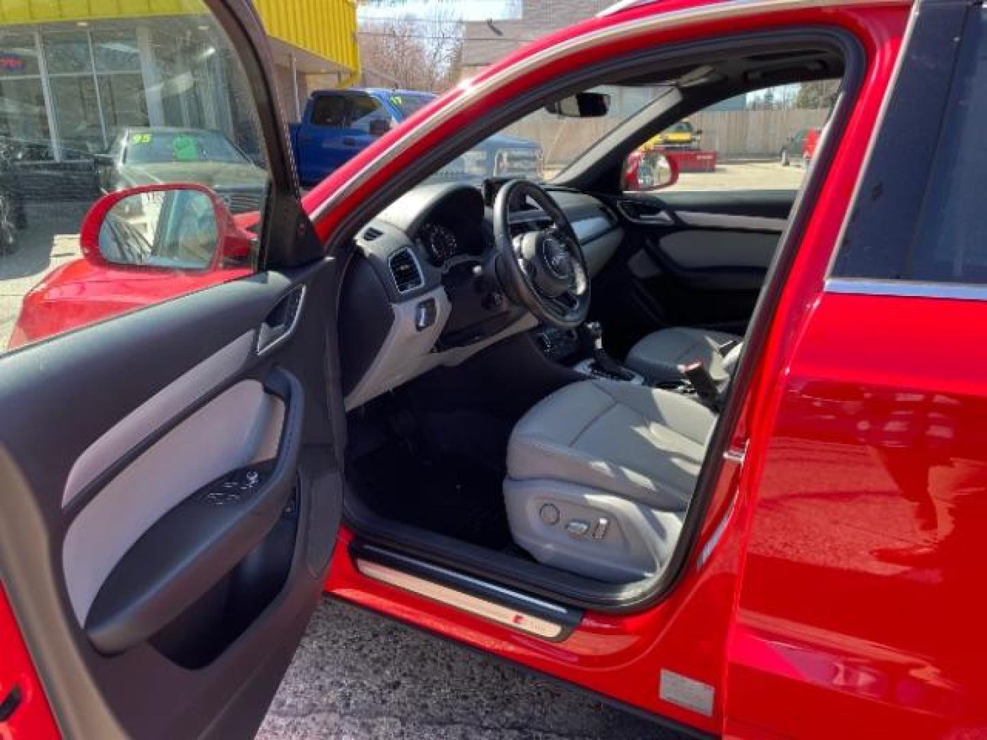 2018 Misano Red Pearl Effect Audi Q3 2.0T Premium (WA1JCCFSXJR) with an 2L I-4 gasoline direct injection engine, located at 745 S Robert St, St. Paul, MN, 55107, (651) 222-2991, 44.923389, -93.081215 - Photo#12