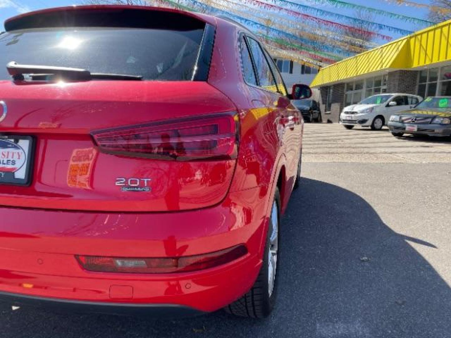 2018 Misano Red Pearl Effect Audi Q3 2.0T Premium (WA1JCCFSXJR) with an 2L I-4 gasoline direct injection engine, located at 745 S Robert St, St. Paul, MN, 55107, (651) 222-2991, 44.923389, -93.081215 - Photo#8