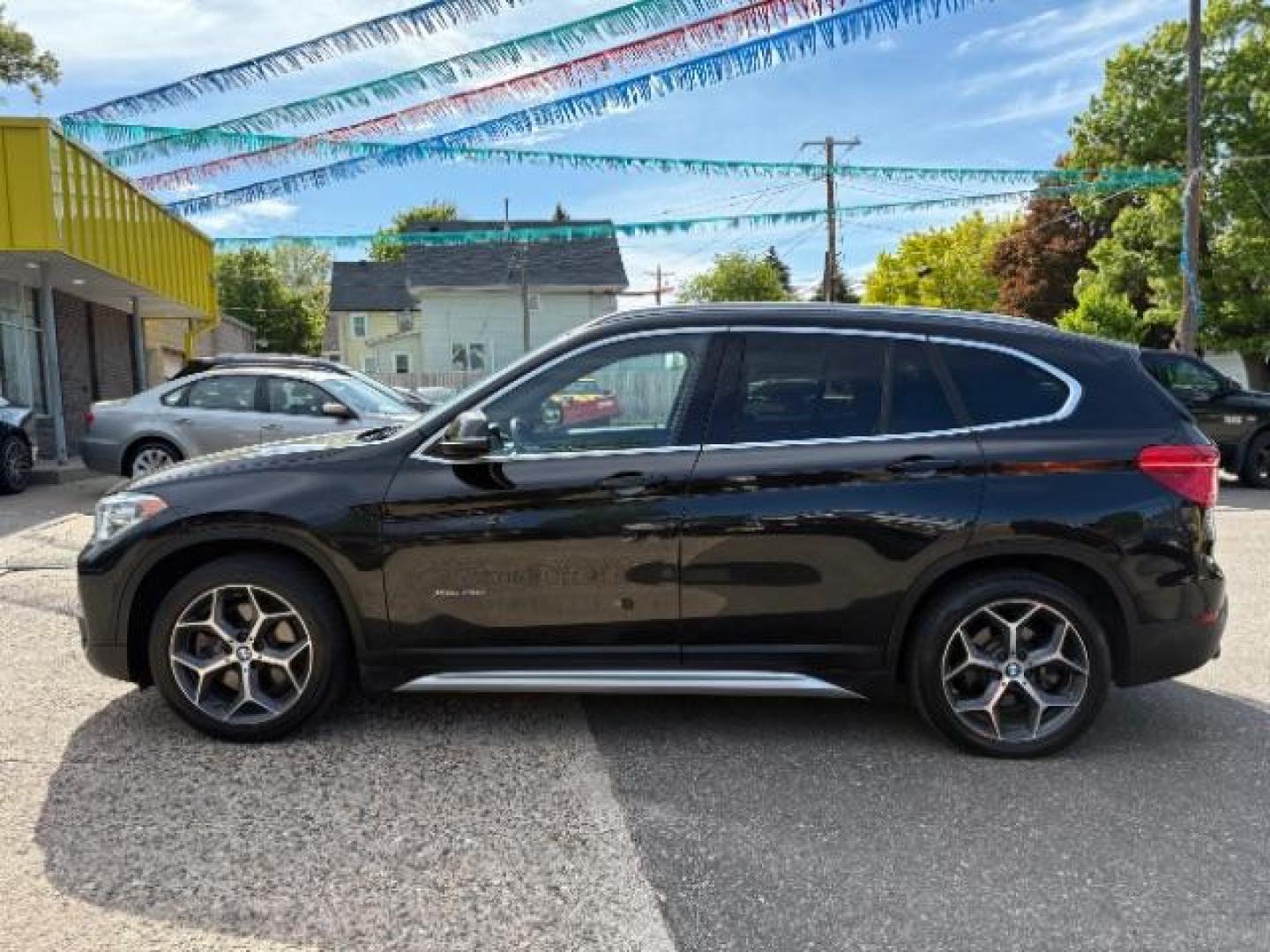 2016 Jet Black BMW X1 xDrive28i (WBXHT3C3XGP) with an 2L I-4 gasoline dire engine, located at 745 S Robert St, St. Paul, MN, 55107, (651) 222-2991, 44.923389, -93.081215 - Photo#3