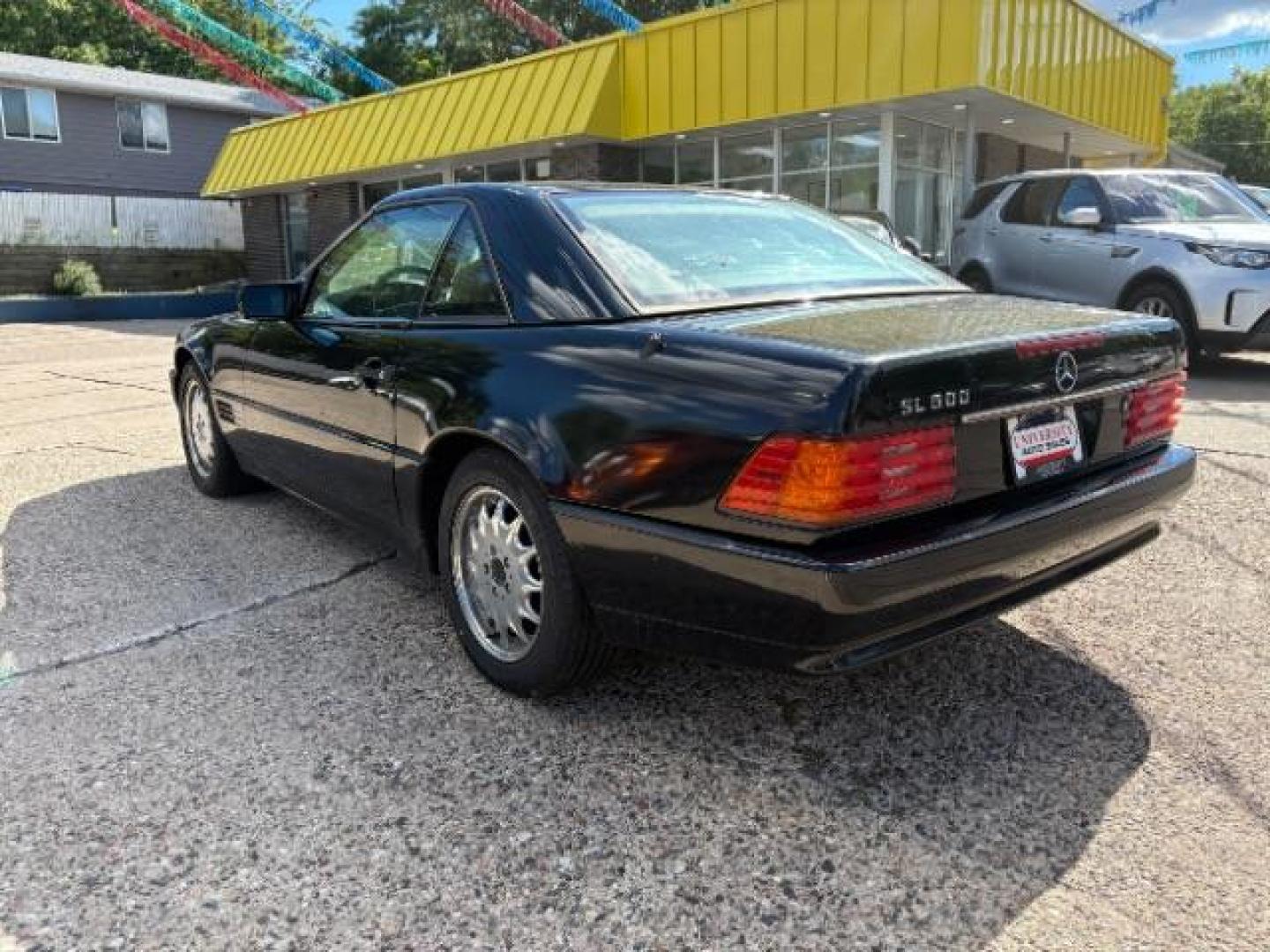 1994 BLACK Mercedes-Benz SL-Class SL500 Roadster (WDBFA67E1RF) with an 5.0L V8 DOHC 32V engine, 4-Speed Automatic transmission, located at 745 S Robert St, St. Paul, MN, 55107, (651) 222-2991, 44.923389, -93.081215- Photo#4