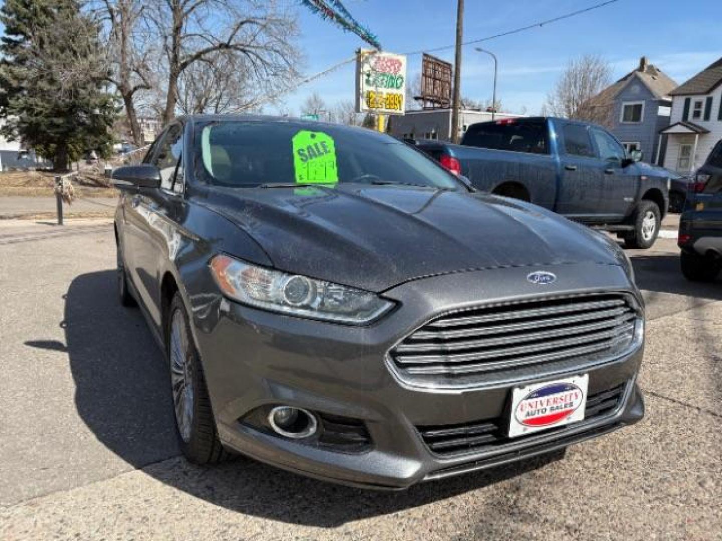 2016 Guard Metallic Ford Fusion Titanium (3FA6P0K95GR) with an 2.0L L4 DOHC 16V engine, 6-Speed Automatic transmission, located at 745 S Robert St, St. Paul, MN, 55107, (651) 222-2991, 44.923389, -93.081215 - Photo#1