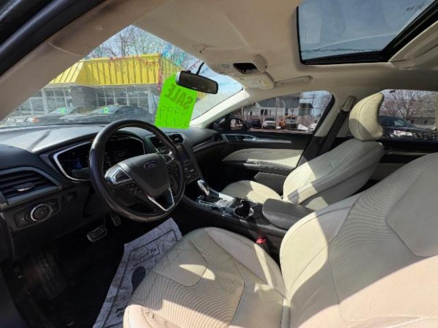 2016 Guard Metallic Ford Fusion Titanium (3FA6P0K95GR) with an 2.0L L4 DOHC 16V engine, 6-Speed Automatic transmission, located at 745 S Robert St, St. Paul, MN, 55107, (651) 222-2991, 44.923389, -93.081215 - Photo#9