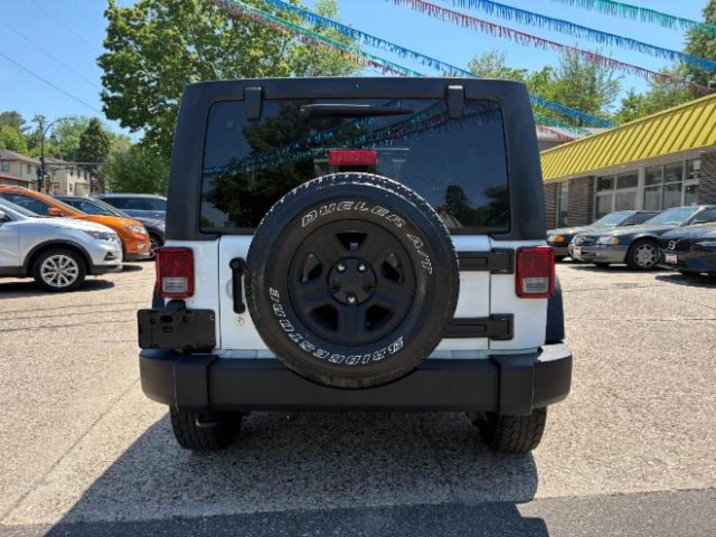 2016 Bright White Clearcoat Jeep Wrangler Unlimited Sport (1C4BJWDG5GL) with an Pentastar 3.6L V-6 DOHC engine, located at 745 S Robert St, St. Paul, MN, 55107, (651) 222-2991, 44.923389, -93.081215 - Photo#4
