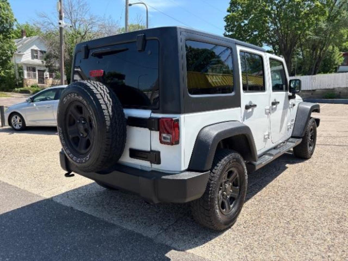 2016 Bright White Clearcoat Jeep Wrangler Unlimited Sport (1C4BJWDG5GL) with an Pentastar 3.6L V-6 DOHC engine, located at 745 S Robert St, St. Paul, MN, 55107, (651) 222-2991, 44.923389, -93.081215 - Photo#7