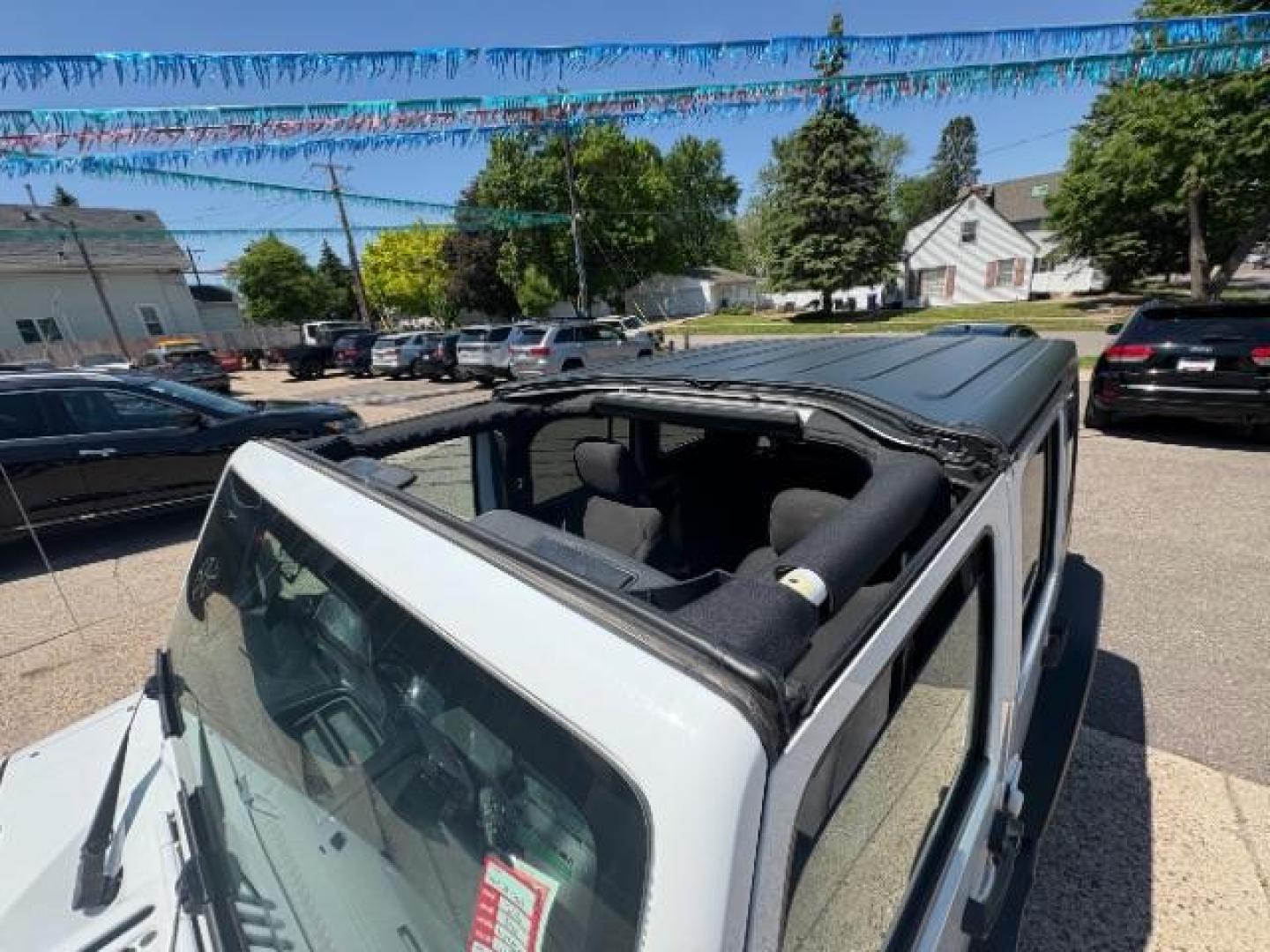 2016 Bright White Clearcoat Jeep Wrangler Unlimited Sport (1C4BJWDG5GL) with an Pentastar 3.6L V-6 DOHC engine, located at 745 S Robert St, St. Paul, MN, 55107, (651) 222-2991, 44.923389, -93.081215 - Photo#9