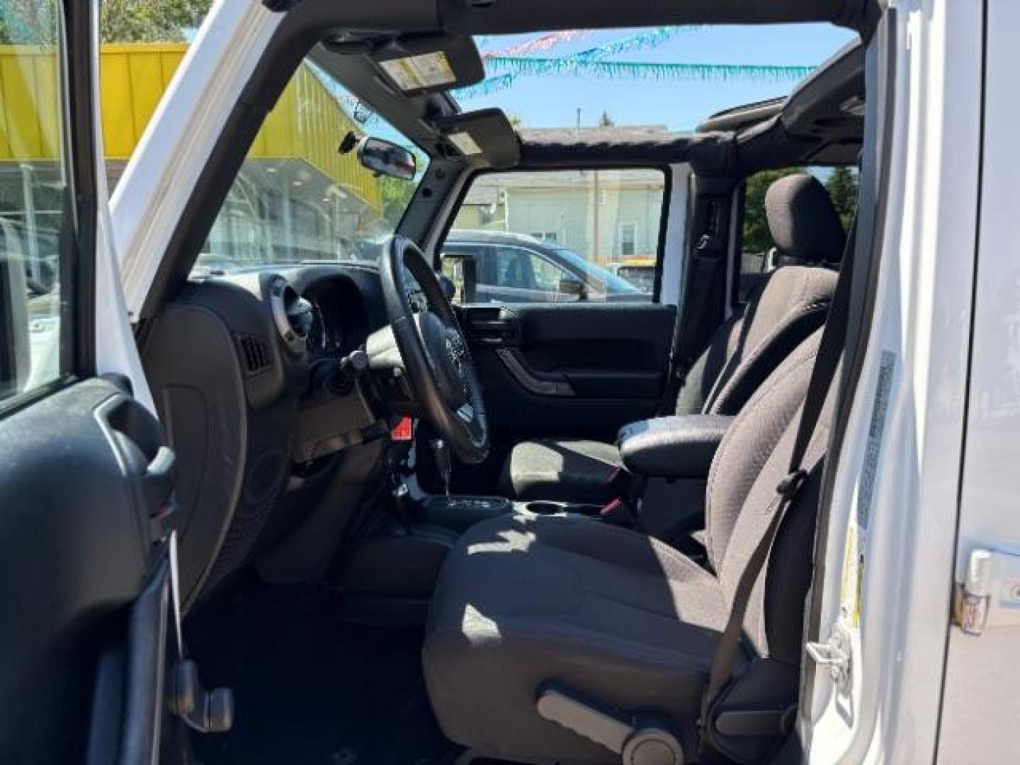2016 Bright White Clearcoat Jeep Wrangler Unlimited Sport (1C4BJWDG5GL) with an Pentastar 3.6L V-6 DOHC engine, located at 745 S Robert St, St. Paul, MN, 55107, (651) 222-2991, 44.923389, -93.081215 - Photo#10
