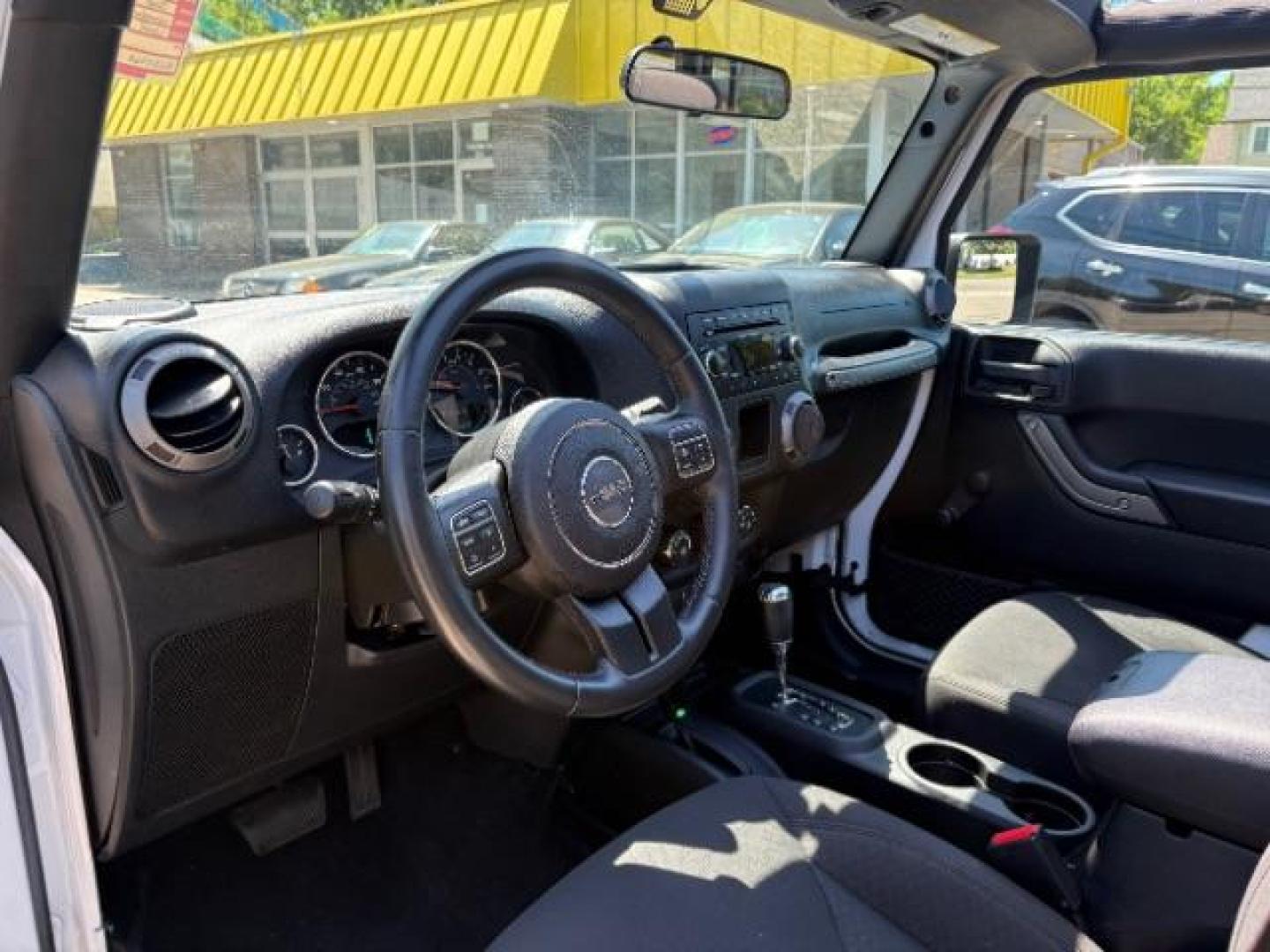 2016 Bright White Clearcoat Jeep Wrangler Unlimited Sport (1C4BJWDG5GL) with an Pentastar 3.6L V-6 DOHC engine, located at 745 S Robert St, St. Paul, MN, 55107, (651) 222-2991, 44.923389, -93.081215 - Photo#11