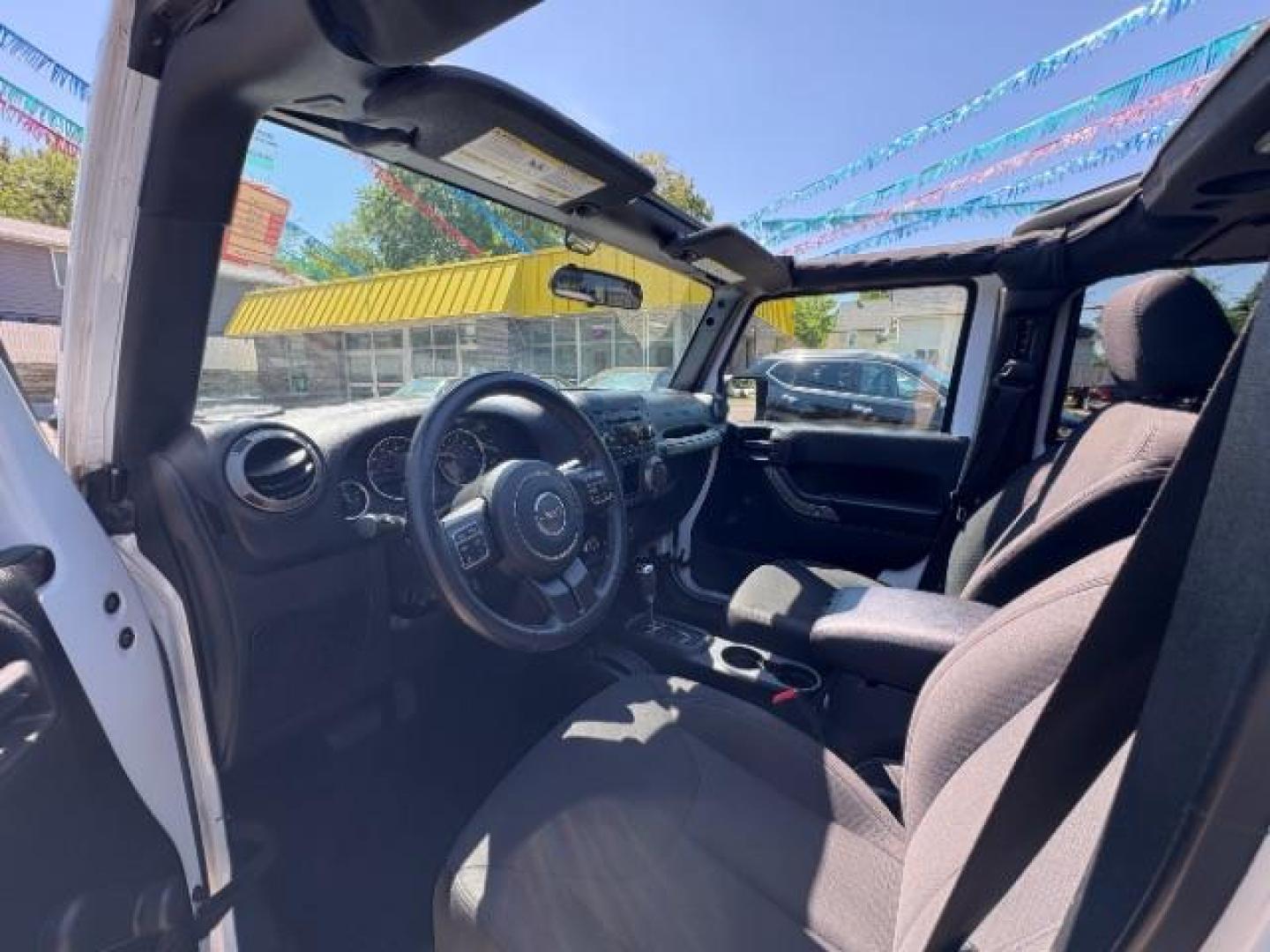 2016 Bright White Clearcoat Jeep Wrangler Unlimited Sport (1C4BJWDG5GL) with an Pentastar 3.6L V-6 DOHC engine, located at 745 S Robert St, St. Paul, MN, 55107, (651) 222-2991, 44.923389, -93.081215 - Photo#13
