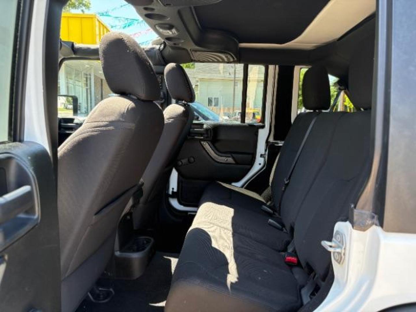 2016 Bright White Clearcoat Jeep Wrangler Unlimited Sport (1C4BJWDG5GL) with an Pentastar 3.6L V-6 DOHC engine, located at 745 S Robert St, St. Paul, MN, 55107, (651) 222-2991, 44.923389, -93.081215 - Photo#16