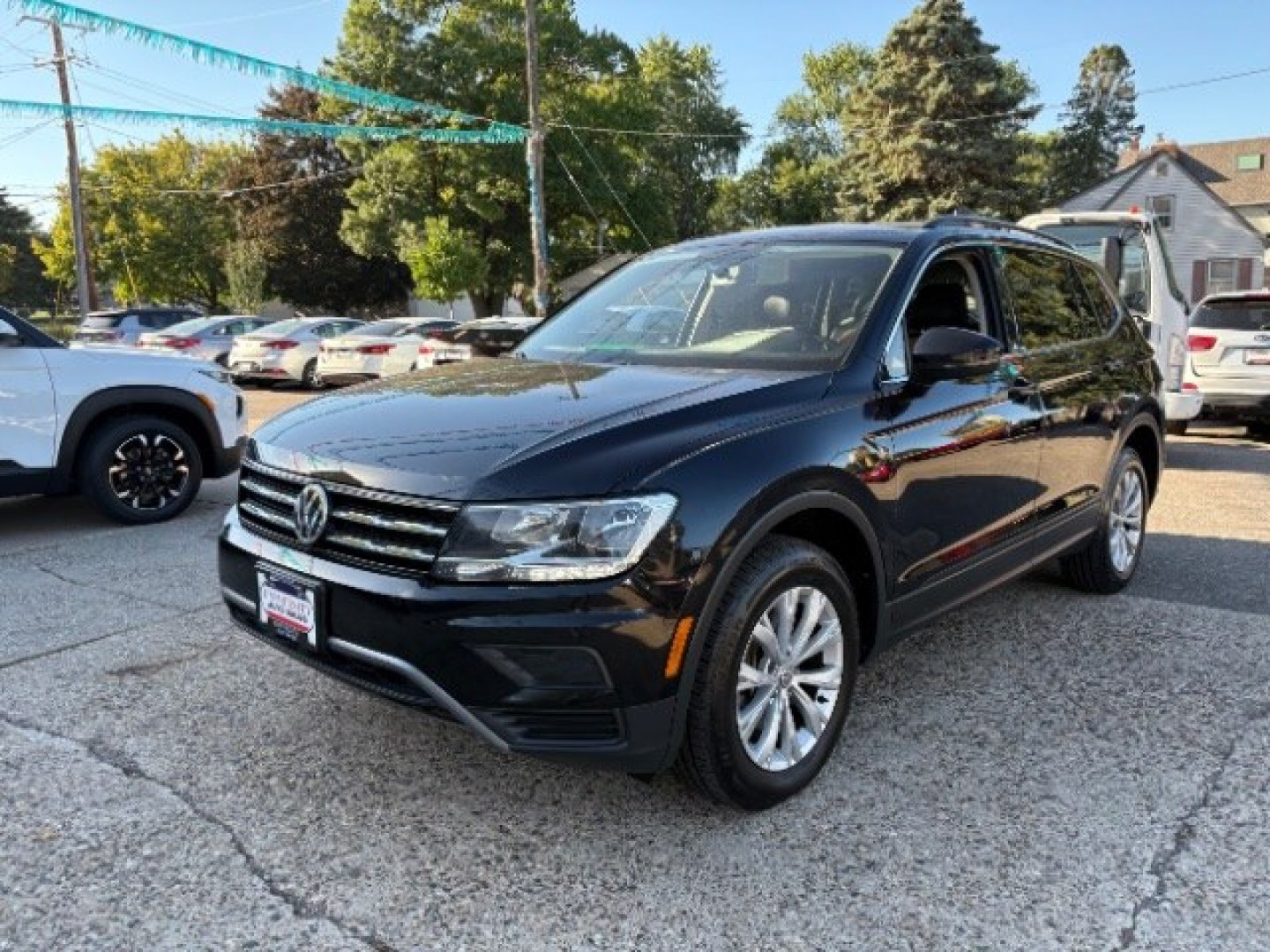 2019 Deep Black Pearl Volkswagen Tiguan 2.0T SE | 2.0T SEL | 2.0T SEL R-Line | 2.0T SEL R-Line Black (3VV2B7AXXKM) with an 2L I-4 direct injection engine, located at 745 S Robert St, St. Paul, MN, 55107, (651) 222-2991, 44.923389, -93.081215- Photo#2