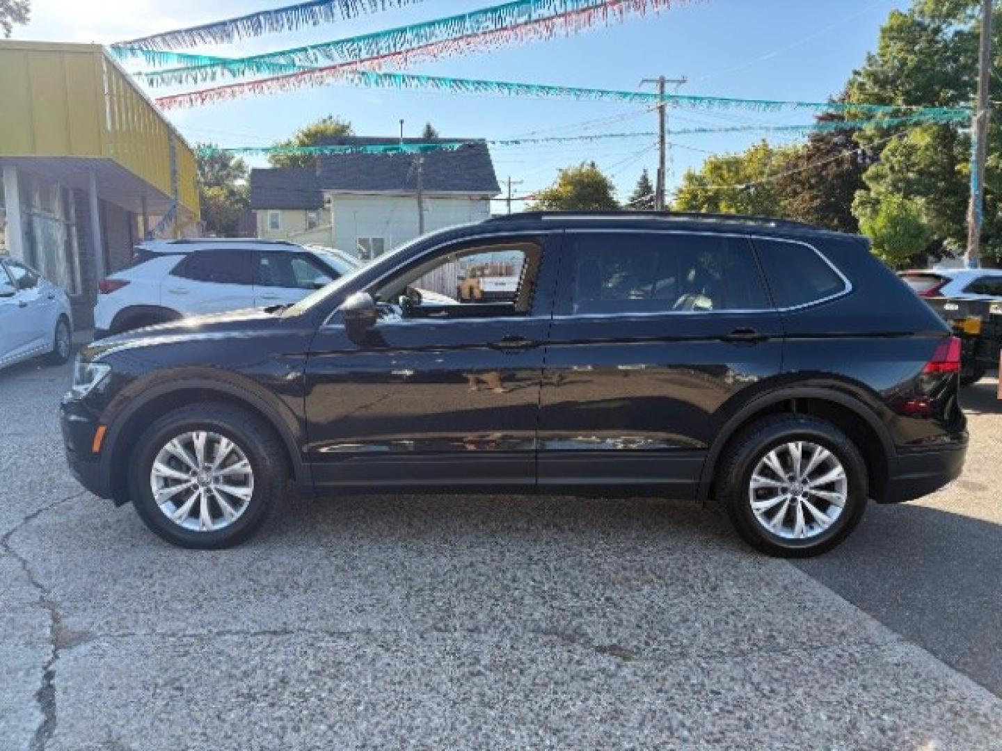 2019 Deep Black Pearl Volkswagen Tiguan 2.0T SE | 2.0T SEL | 2.0T SEL R-Line | 2.0T SEL R-Line Black (3VV2B7AXXKM) with an 2L I-4 direct injection engine, located at 745 S Robert St, St. Paul, MN, 55107, (651) 222-2991, 44.923389, -93.081215- Photo#3