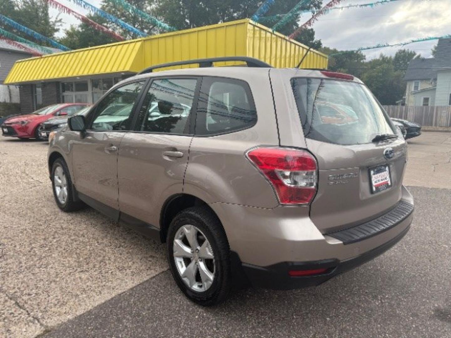 2015 Burnished Bronze Metallic Subaru Forester 2.5i (JF2SJABC0FH) with an 2.5L H-4 DOHC engine, located at 745 S Robert St, St. Paul, MN, 55107, (651) 222-2991, 44.923389, -93.081215- Photo#4